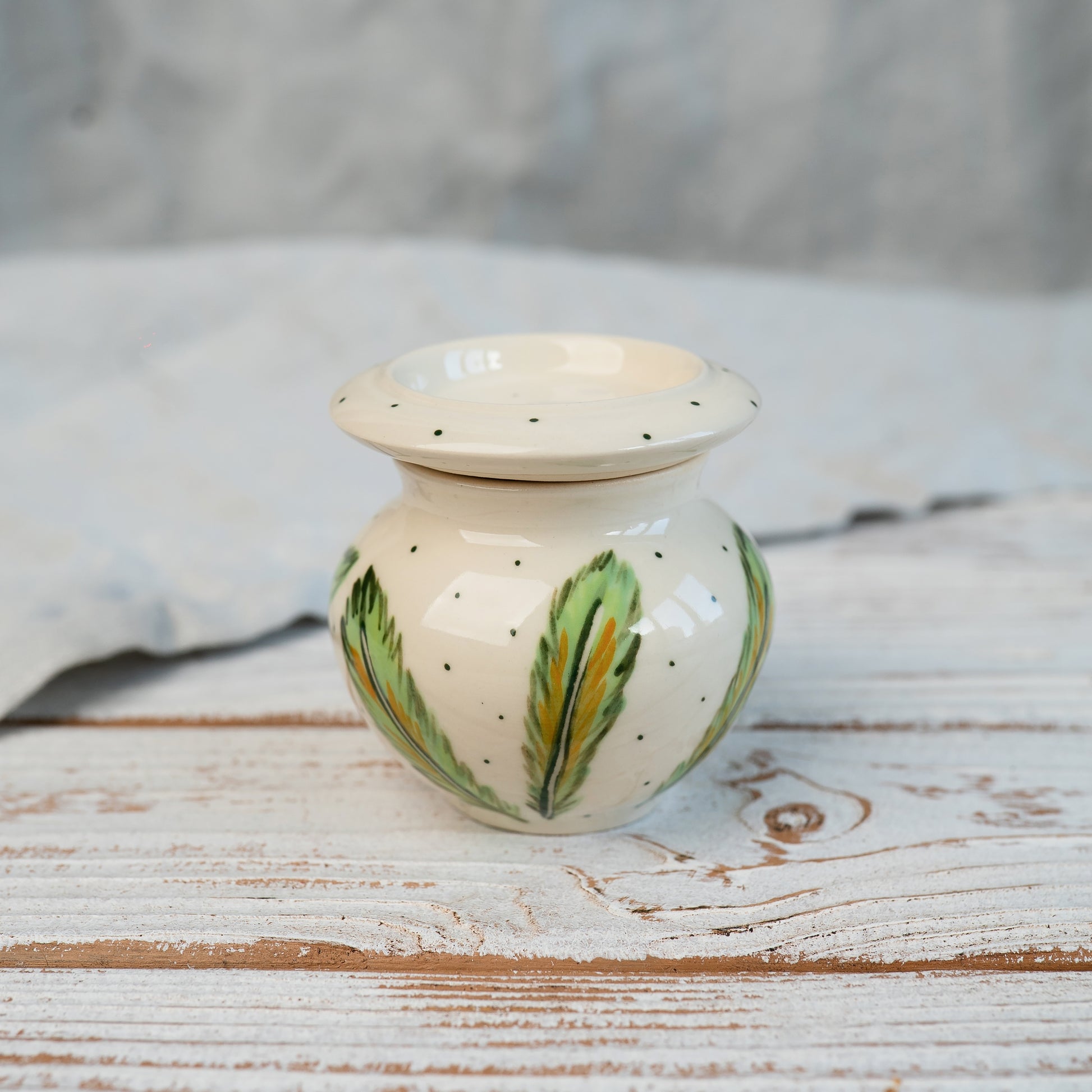 Parrot urn with green feather print