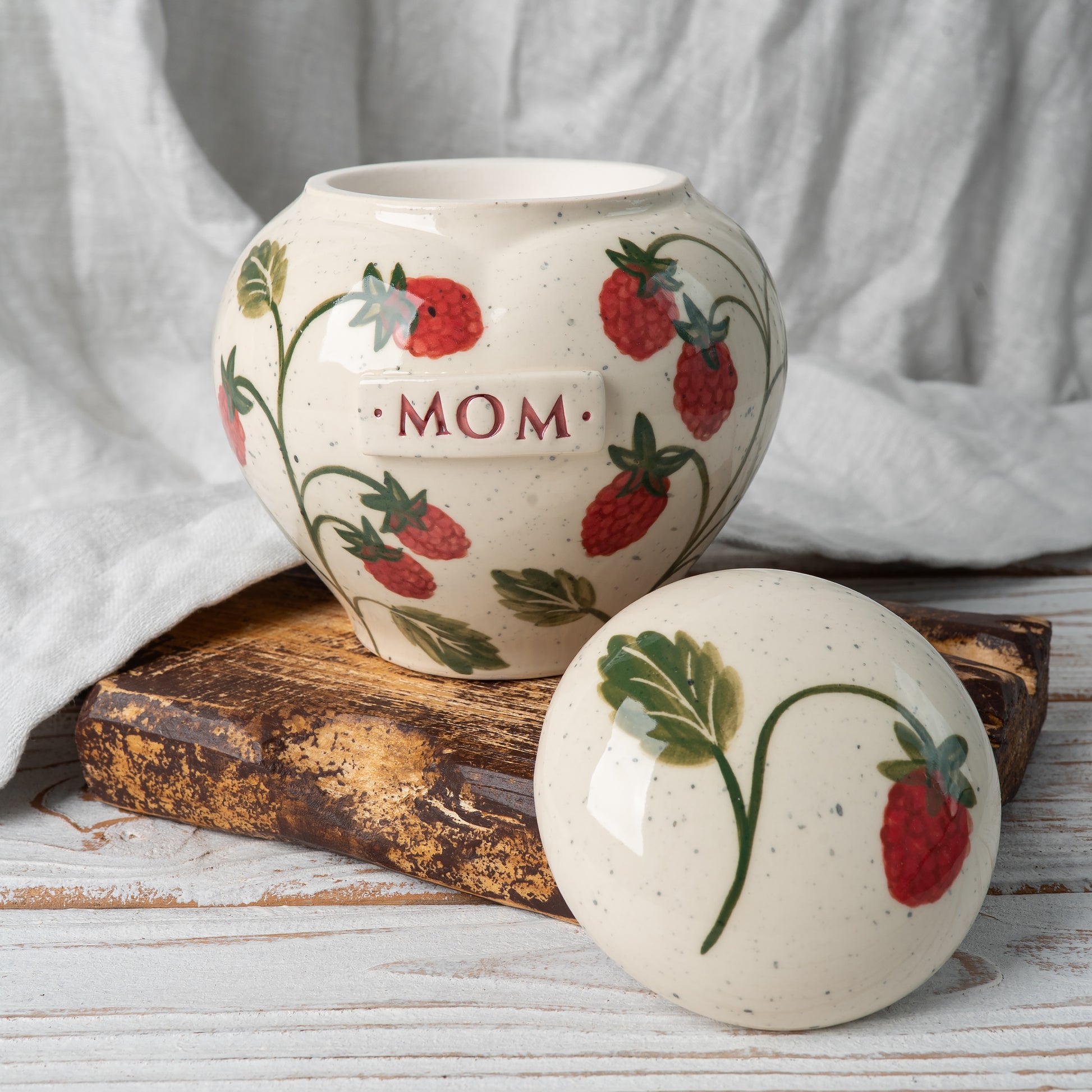 Raspberry heart urn with open lid