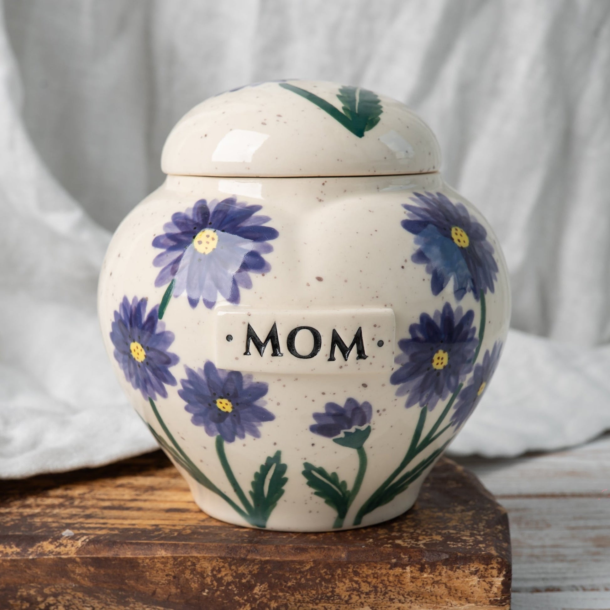 Aster heart-shaped ceramic urn for ashes with September birth flower design front view