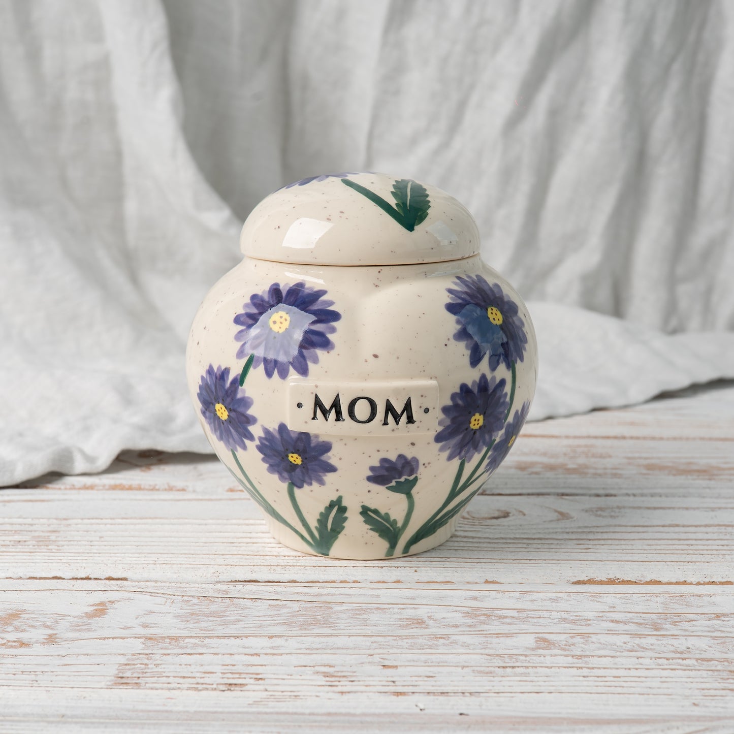 Aster heart-shaped ceramic urn for ashes with September birth flower design front view