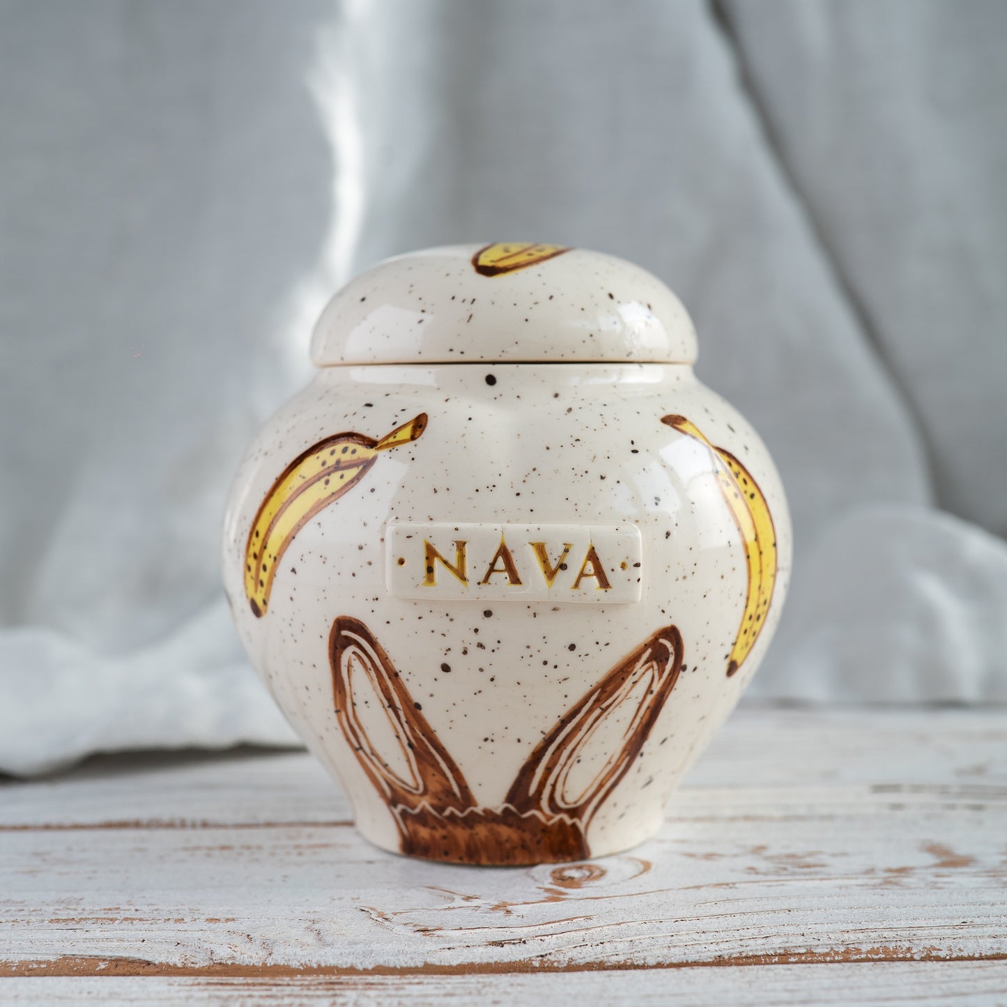 Banana bunny ears heart-shaped ceramic urn for rabbit ashes custom pet memorial front view