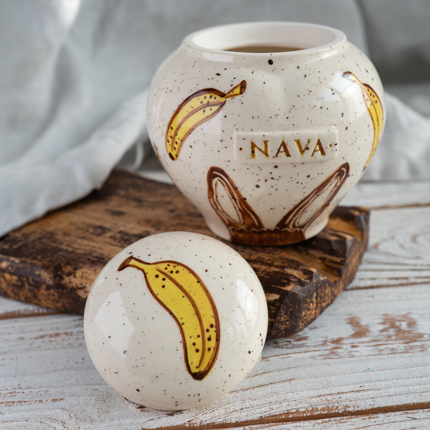 Custom banana bunny ears ceramic rabbit urn shown open revealing inner chamber for ashes