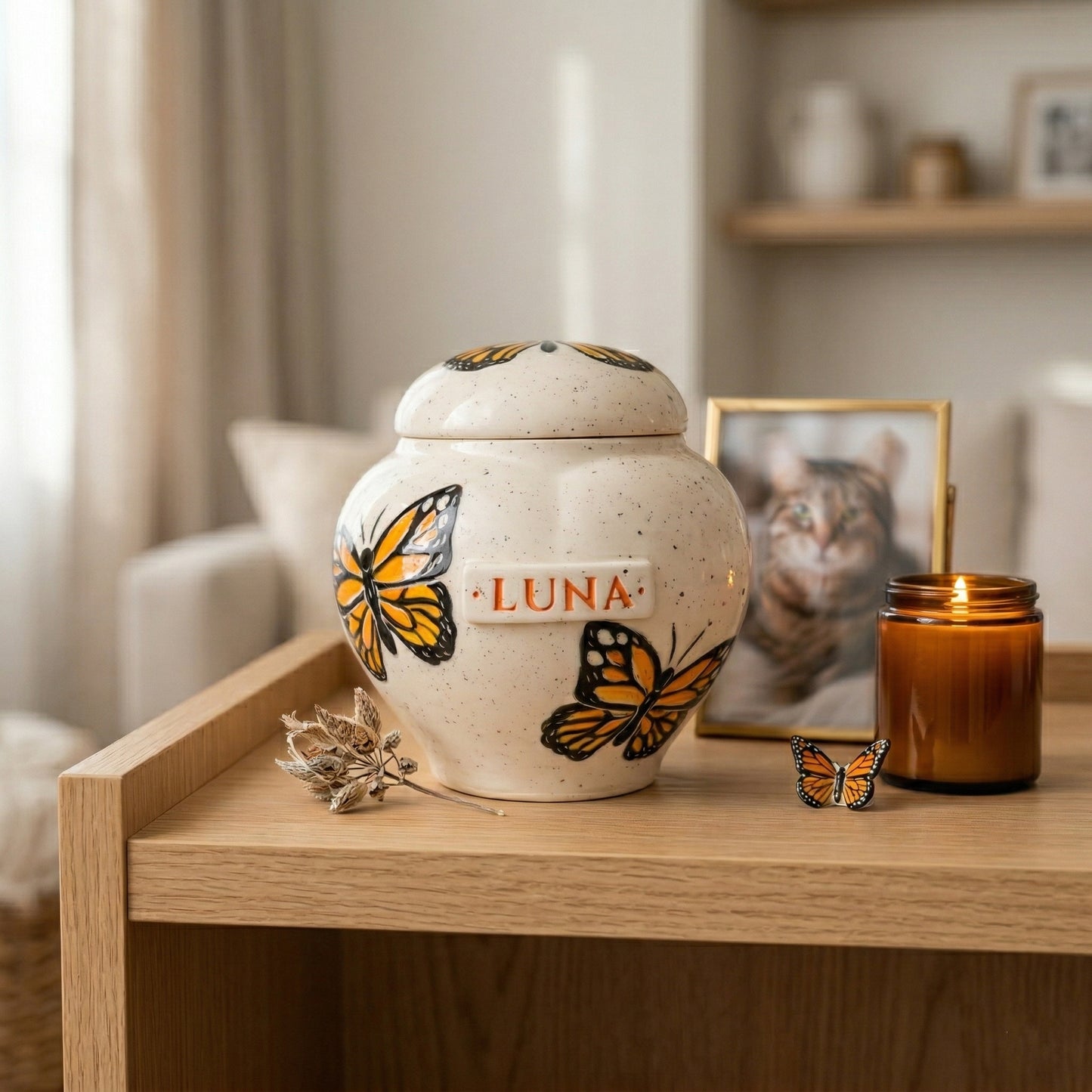 Monarch butterfly ceramic heart urn in a cozy memory corner.