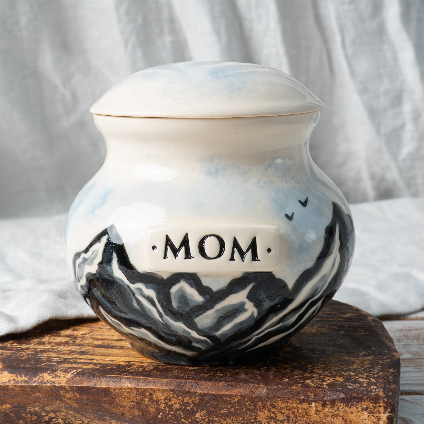 Handcrafted ceramic mountain urn for ashes with personalized MOM plaque front view
