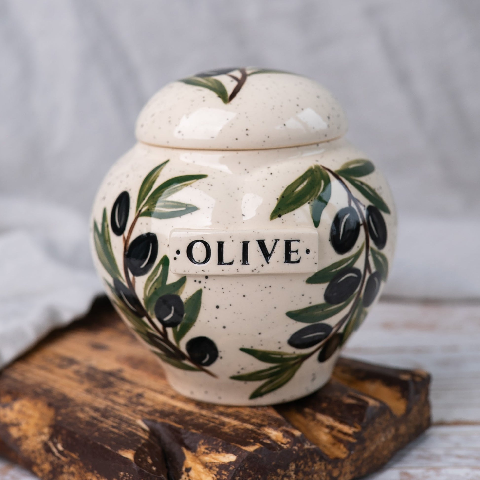 Hand-painted olive branch ceramic heart urn by Mira Ceramics