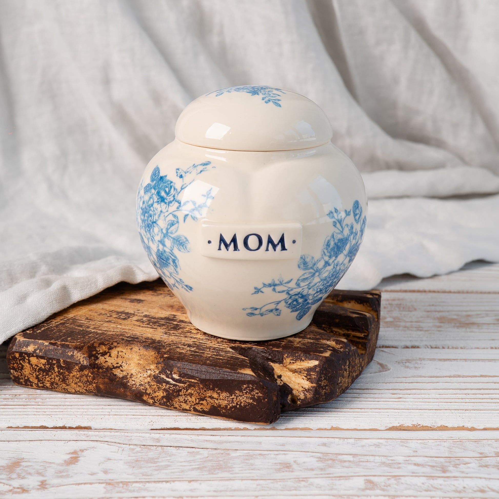 view of hand-painted heart ceramic urn showing intricate blue and white floral toile pattern