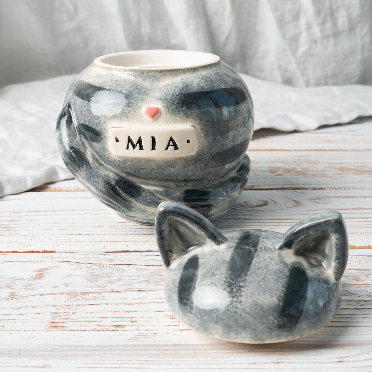 Custom gray tabby cat ceramic urn with cat ears shown open revealing inner chamber for ashes