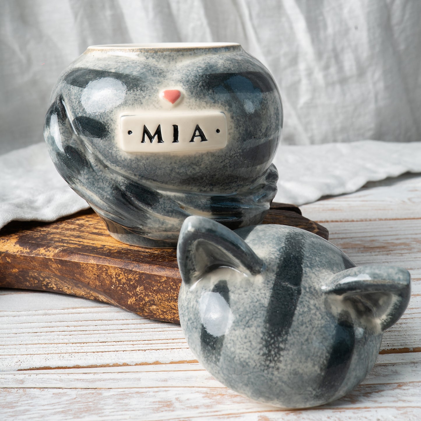 Custom gray tabby cat ceramic urn with cat ears shown open revealing inner chamber for ashes