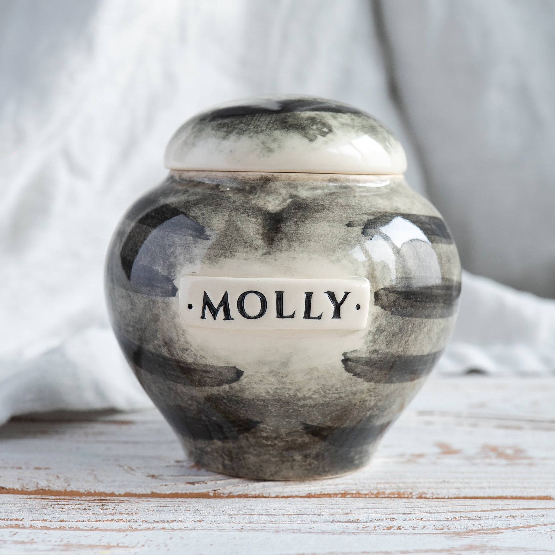 Hand-painted white ceramic heart-shaped urn with grey tabby mackerel stripes