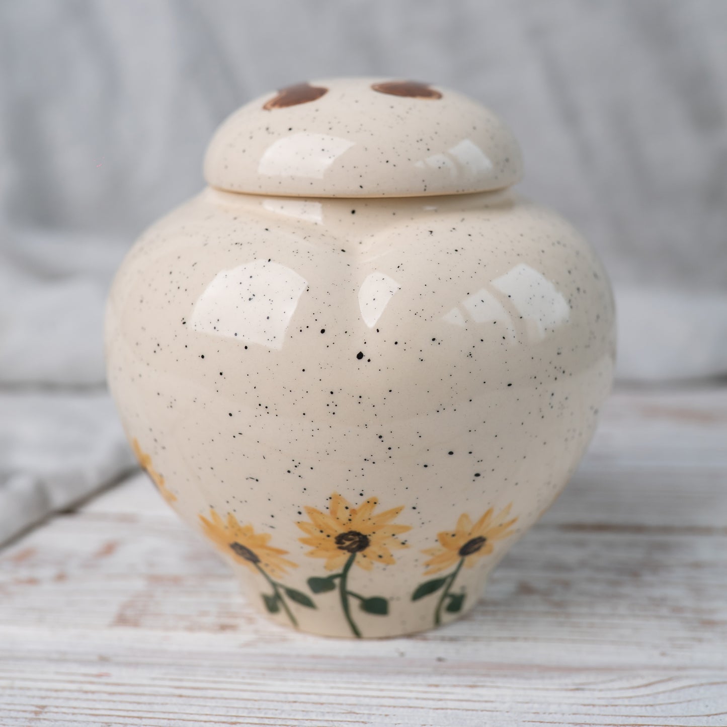 Back view of the smooth white ceramic memorial urn for horses