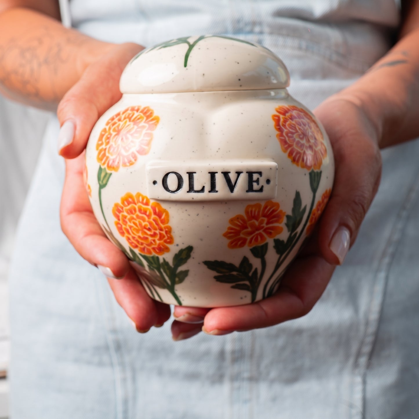 marigold-urn-holding-in-hands