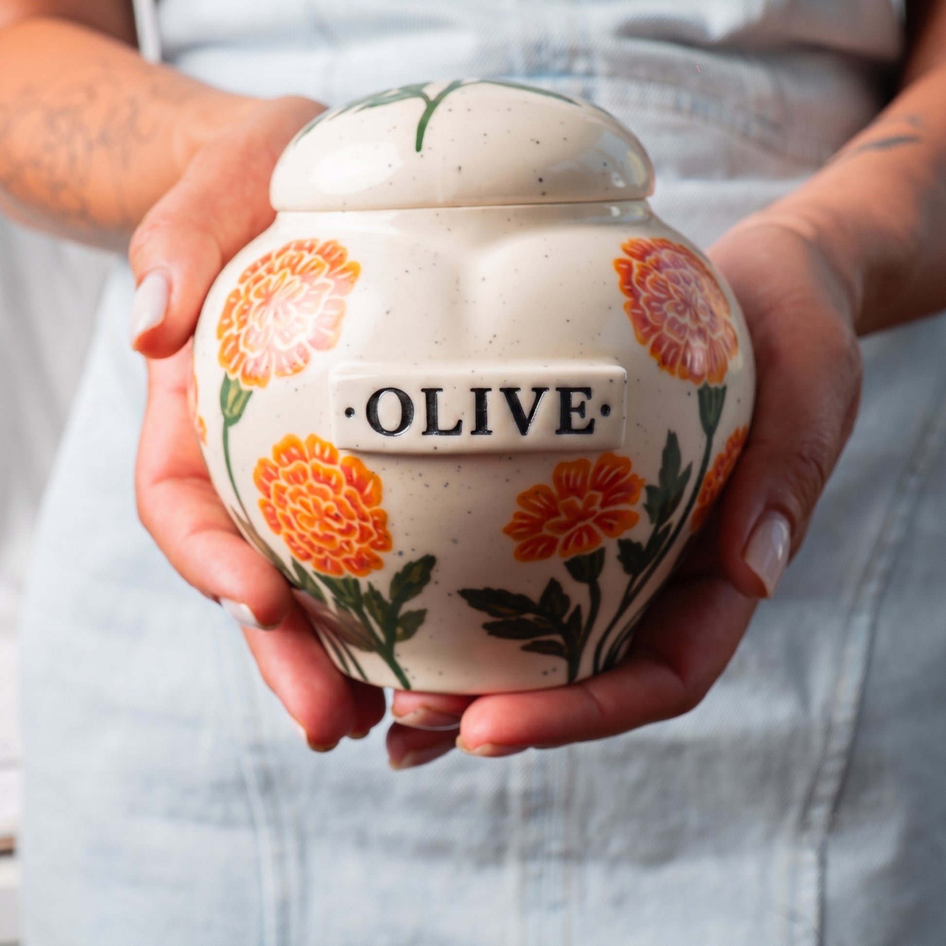 marigold-urn-holding-in-hands