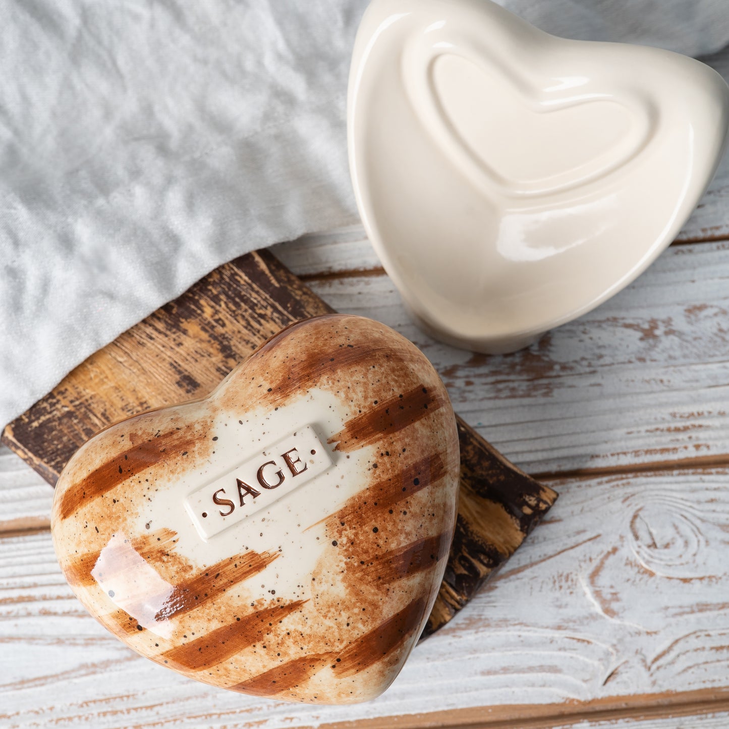 Top view of the orange tabby cat heart urn, showing the detailed striped coat pattern and high-gloss glaze.