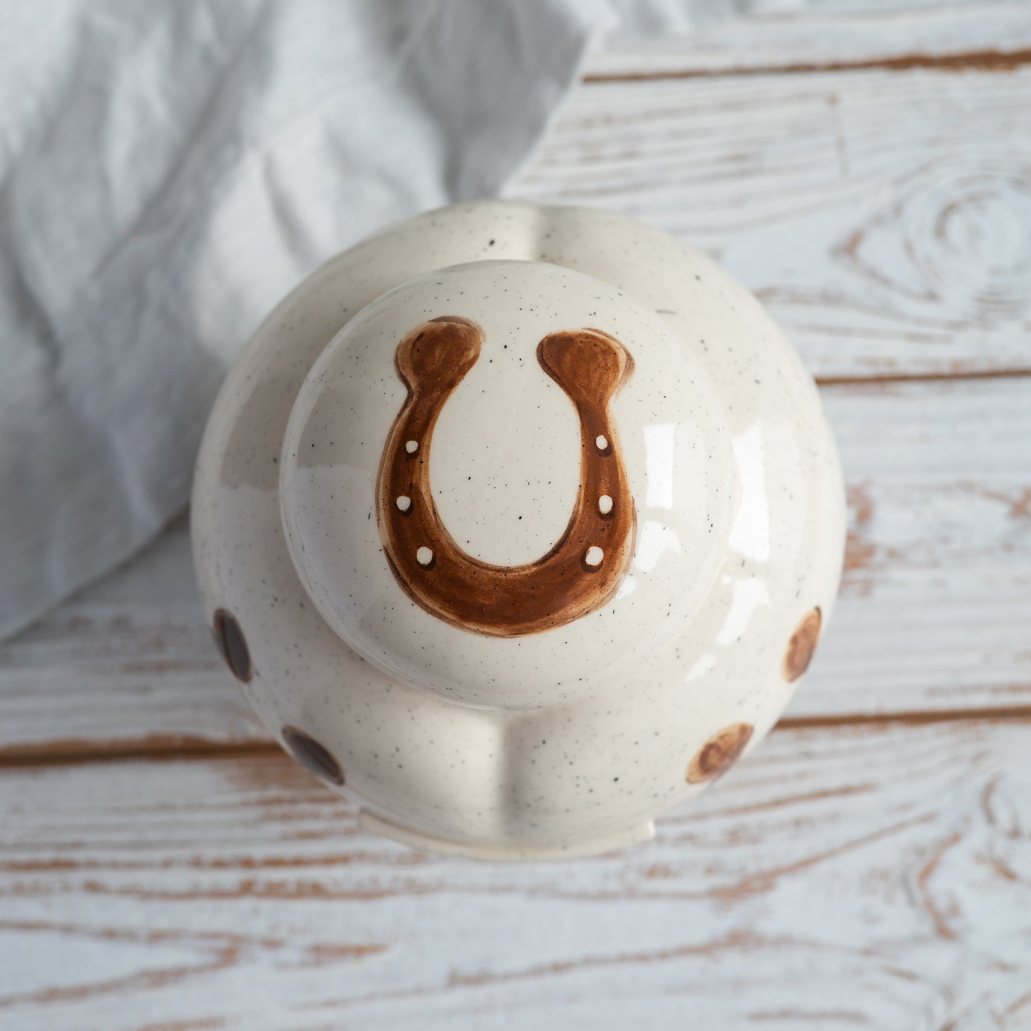 up side view of a personalized heart-shaped horse urn showing the lid area 