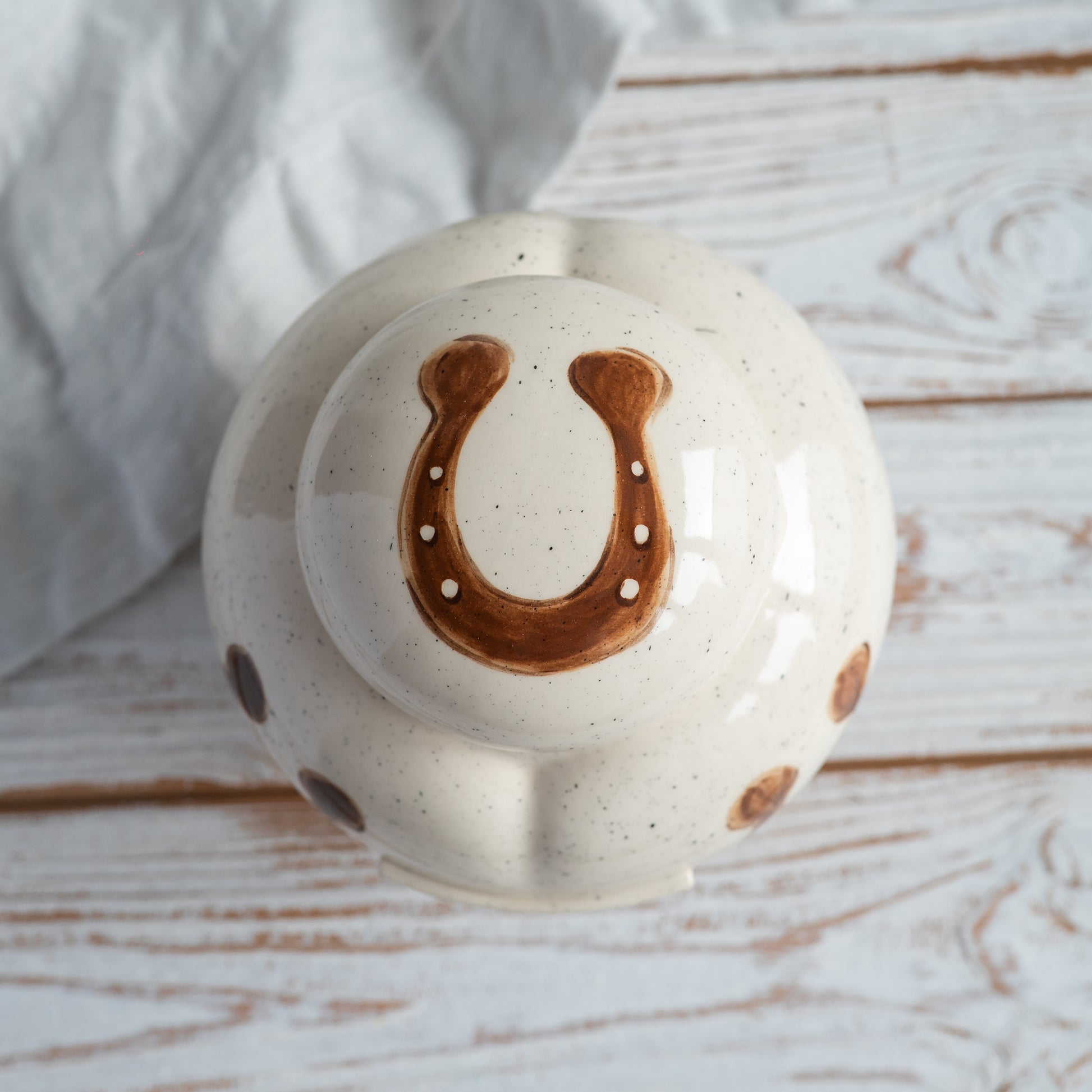 up side view of a personalized heart-shaped horse urn showing the lid area 
