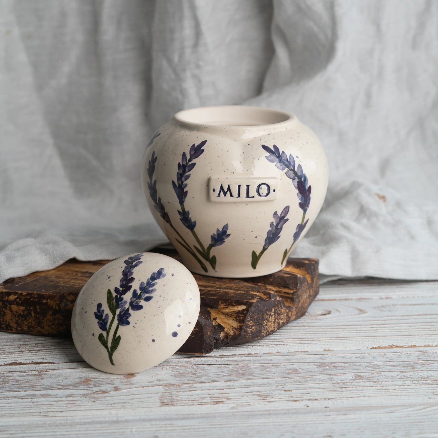 front view of hand-painted lavender on ceramic urn and  lid by Mira Ceramics.