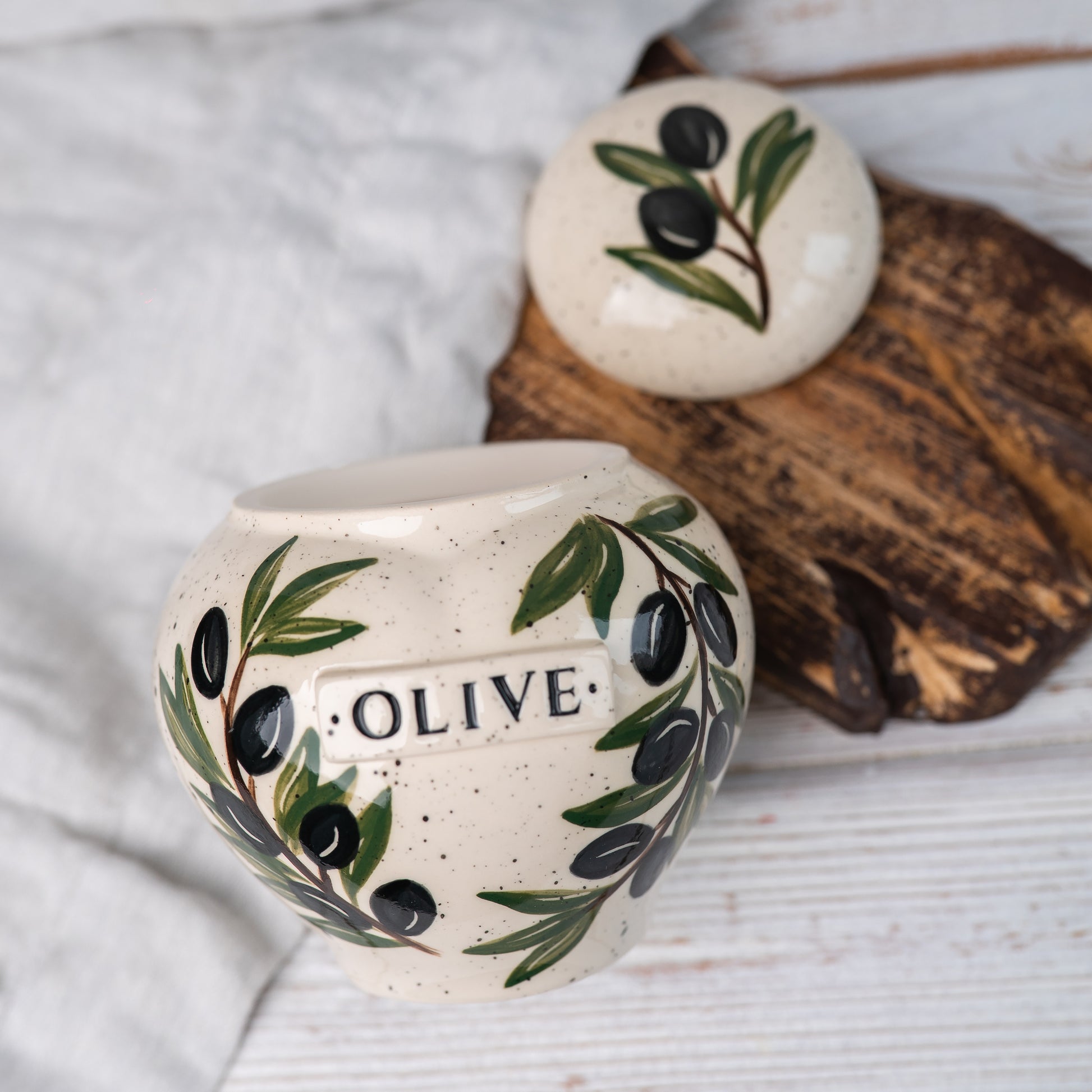 Overhead view of olive patterned ceramic urn