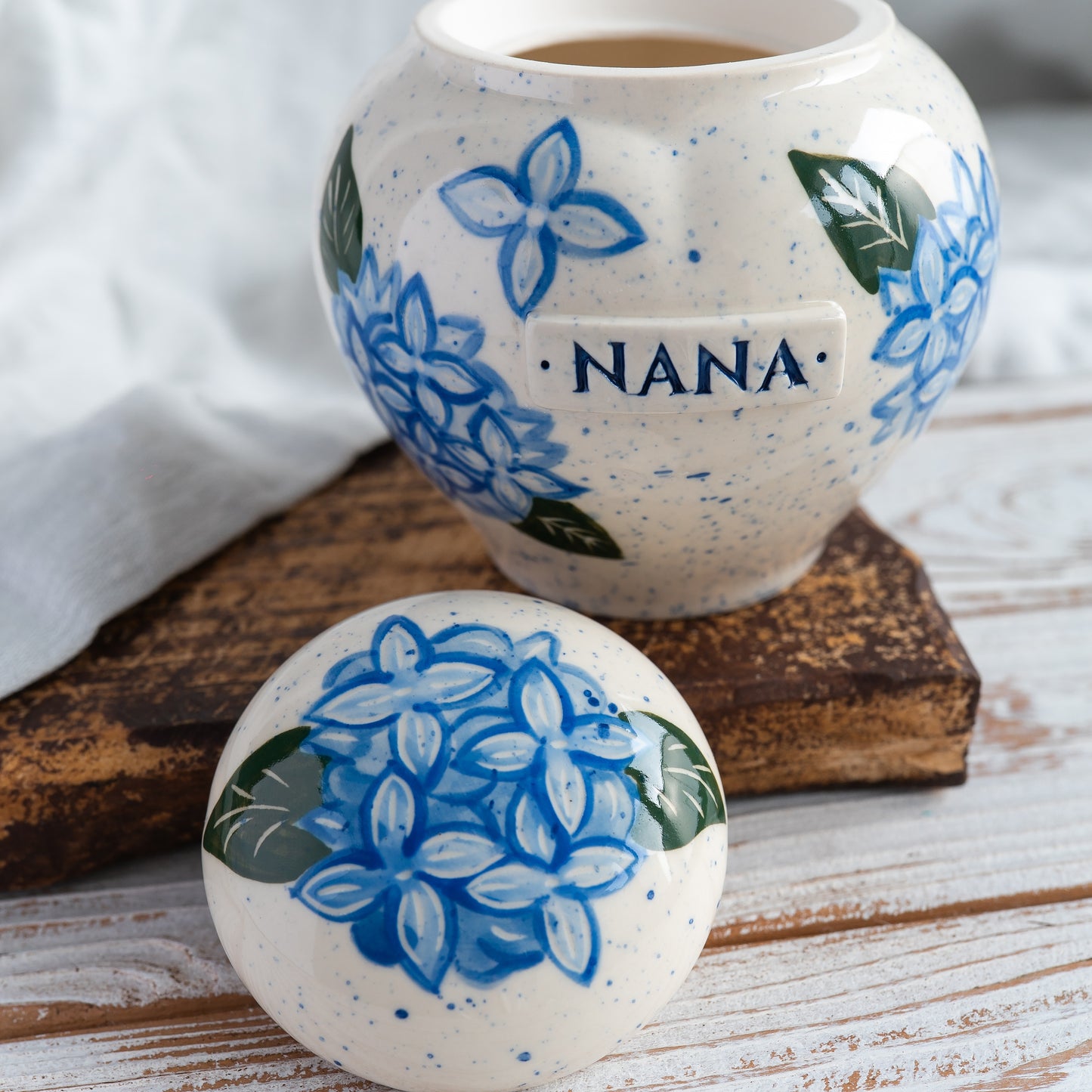 Close-up of open hydrangea ceramic heart urn detail