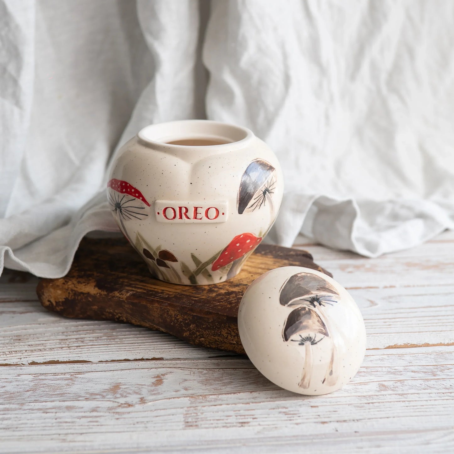 Close-up of open mushrooms ceramic heart urn