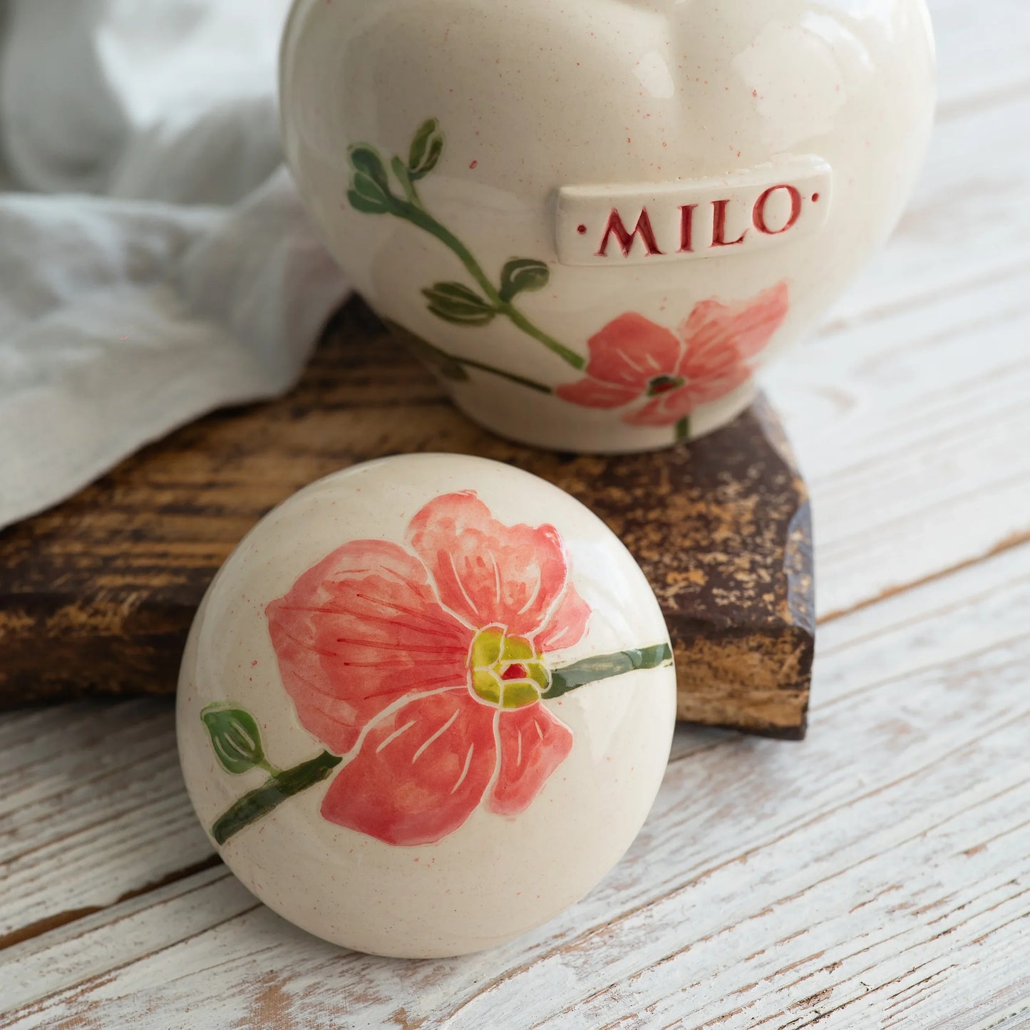 Close-up of open orchid ceramic heart urn detail