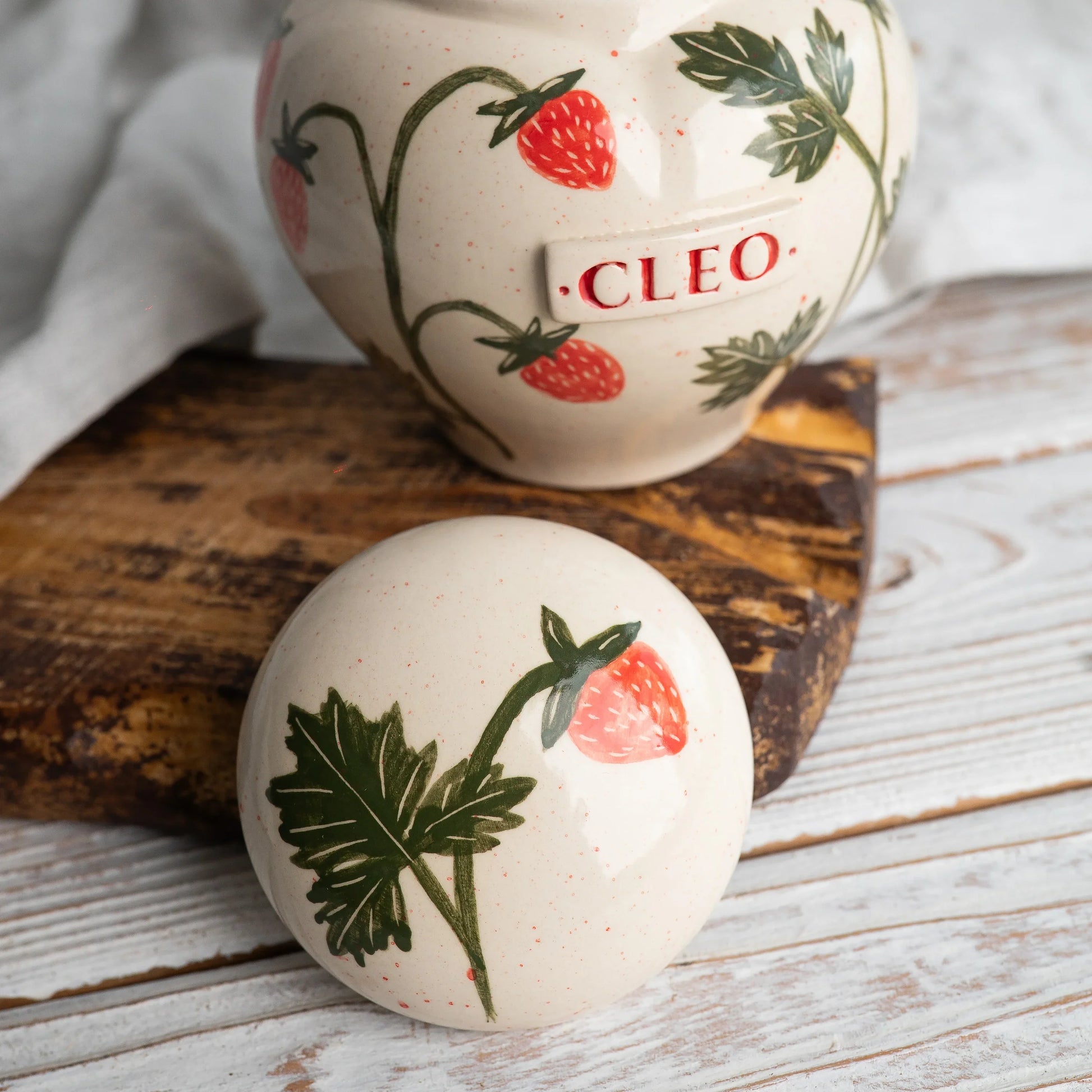 Close-up of open strawberry ceramic heart urn detail