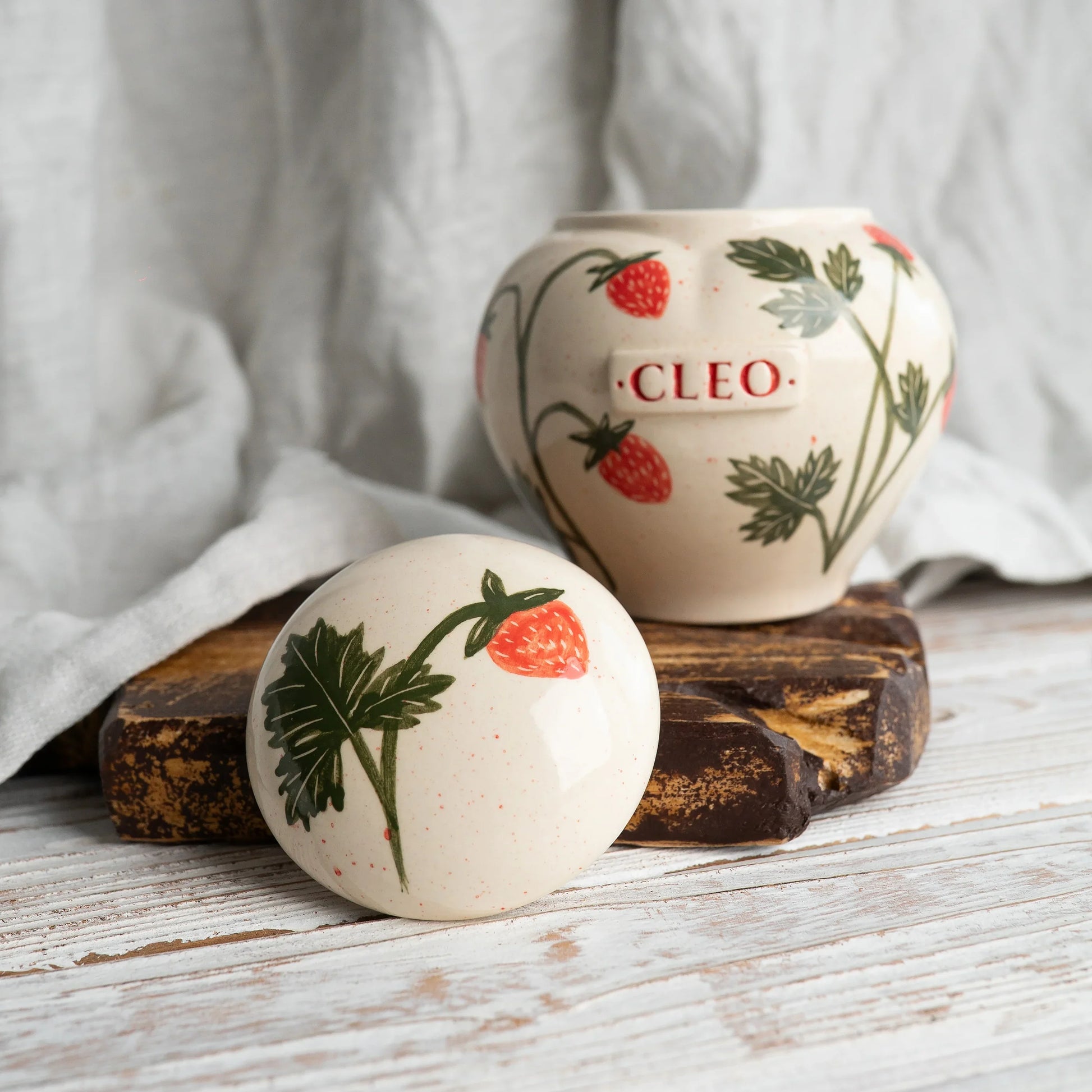 Close-up of open strawberry ceramic heart urn