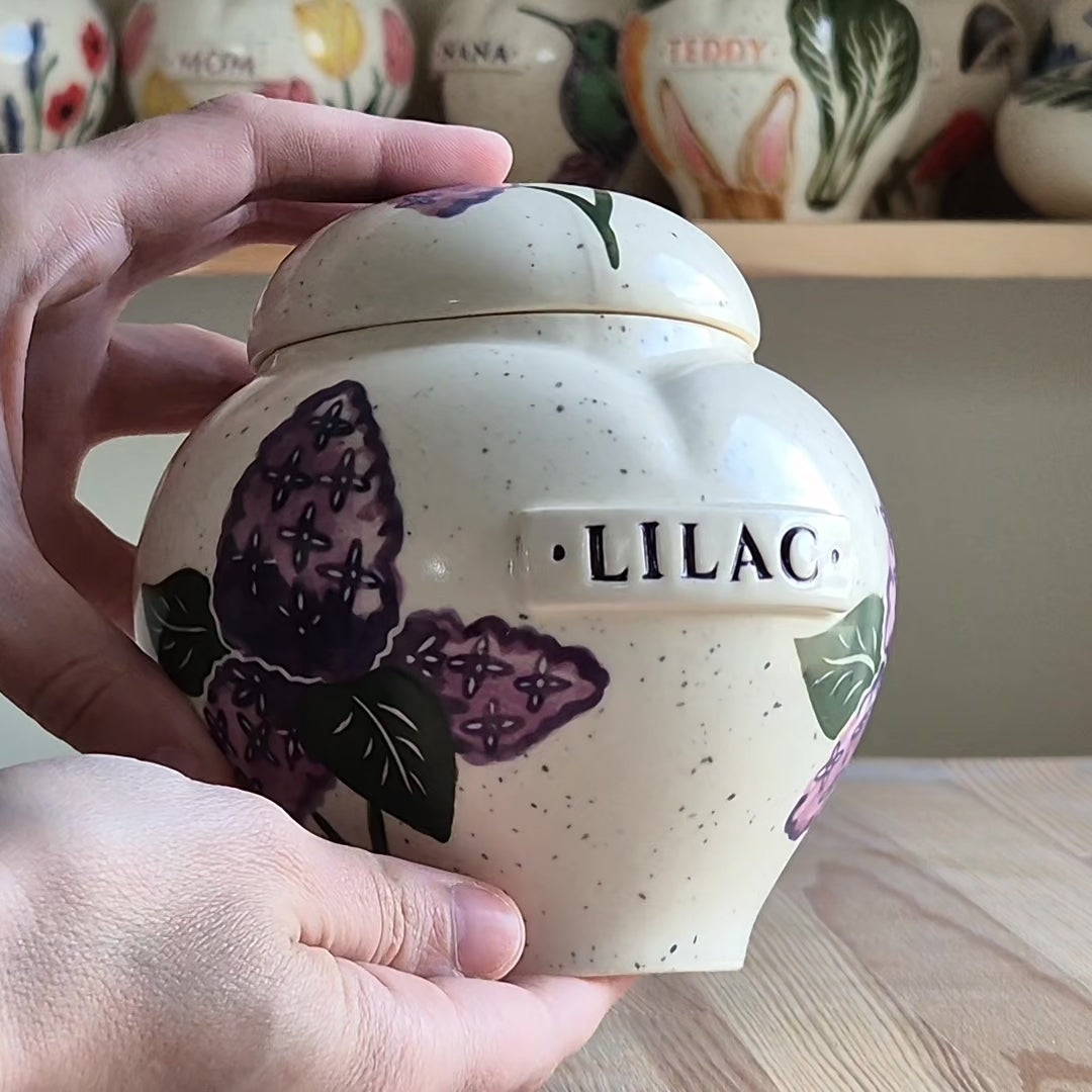 Video showcase of a hand-painted lilac heart-shaped ceramic urn