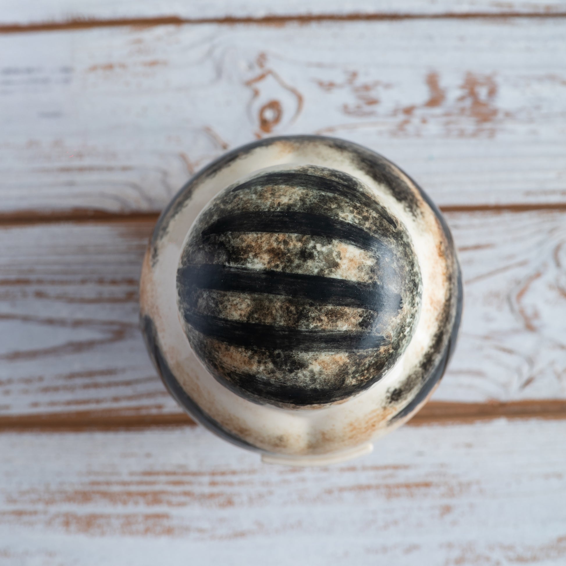 Top view of a closed heart-shaped ceramic pet urn.